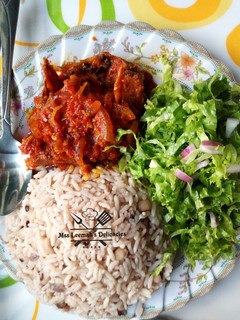 A picture of Rice and Beans with Stew.