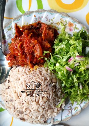 A picture of Rice and Beans with Stew.