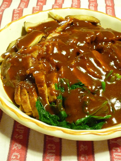 A picture of Pork Tenderloin in Demi-Glace Sauce.