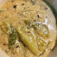 A picture of Thakurbarir Niramish Jhinge Alooer Doodh Jhol (No Garlic Onion- Potato & Ridge Gourd Stew With Milk).