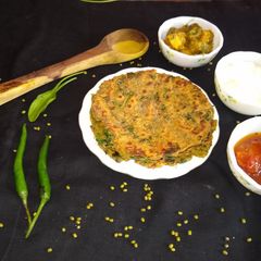 A picture of Whole moong dal and spinach paratha.