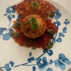 A picture of Crispy Macaroni Bolognese Arancini with Mozzarella & Smoked Cheddar.
