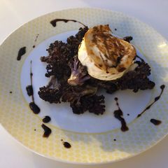 A picture of Roast purple cauliflower and goats cheese.