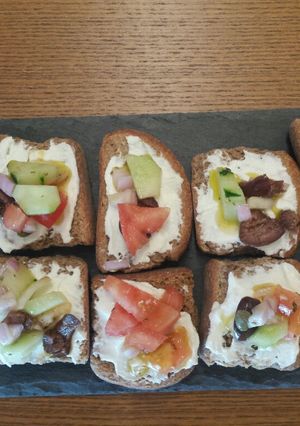 A picture of Barley Rusks with Katiki Cheese and Greek Village Salad.