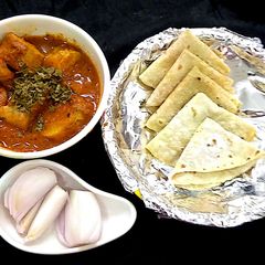 A picture of Kathi kababwith rumali roti.