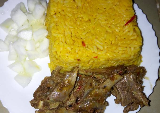 Jollof rice with steamed goat meat and cucumber #KADUNACOOKOUT
