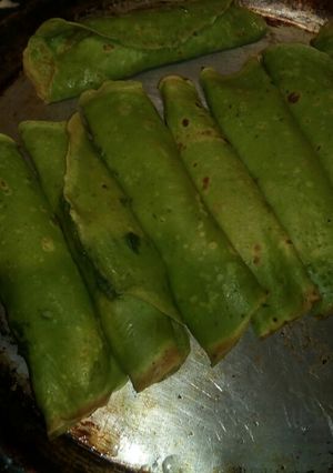 Una foto de Canelones verdes de espinaca y panceta