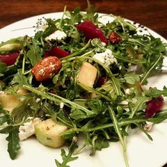 A picture of Healthy arugula,roasted beet,green apple, candied pecans salad.