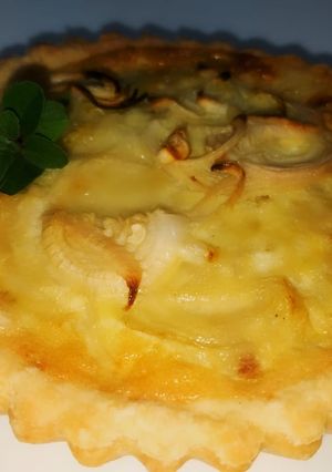 Una foto de Mini tarta de cebollas y queso
