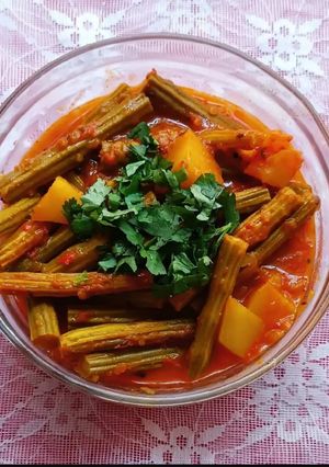 A picture of Drumsticks and Potato Curry.
