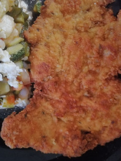 Una foto de Milanesas con mostaza y hierbas