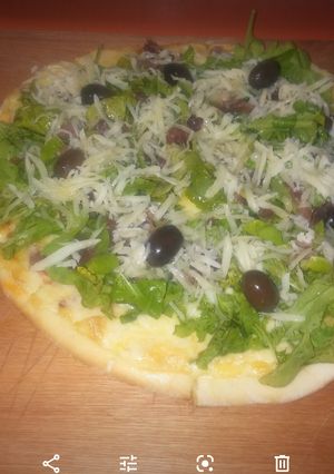 Una foto de Pizza de rúcula