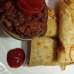 A picture of Leftover chapatis and brown ndengus.