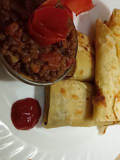 A picture of Leftover chapatis and brown ndengus.
