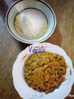 A picture of Porridge beans with garri and milk.