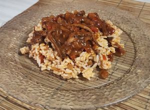 Una foto de 🦑 Arroz con tuco de calamar 🦑