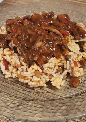 Una foto de 🦑 Arroz con tuco de calamar 🦑