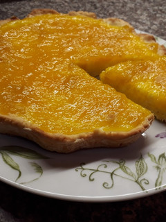 Una foto de Tarta de mango y crema de queso