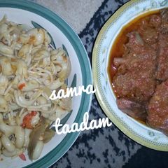 A picture of Jollof macaroni with stew.