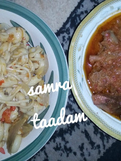 A picture of Jollof macaroni with stew.