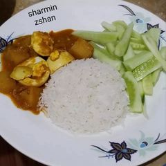 A picture of Anda Aloo gravy with rice #cookpadapp.