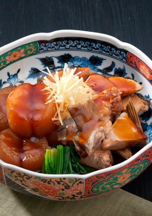 A picture of Japanese Yellowtail Simmered with Daikon Radish.