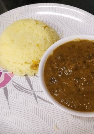 A picture of Sindhi sai bhaji with yellow rice.