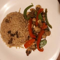 A picture of Pilau served in mushrooms veges.
