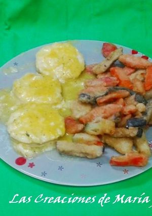 Una foto de Medallones de merluza en salsa de naranja