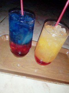 A picture of Sunrise mocktail nd Blue layered paradise.