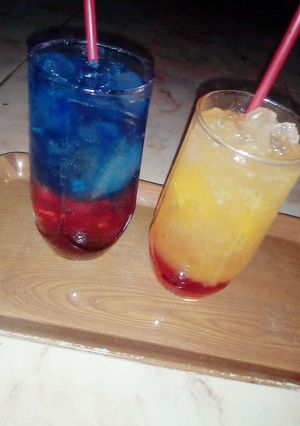A picture of Sunrise mocktail nd Blue layered paradise.