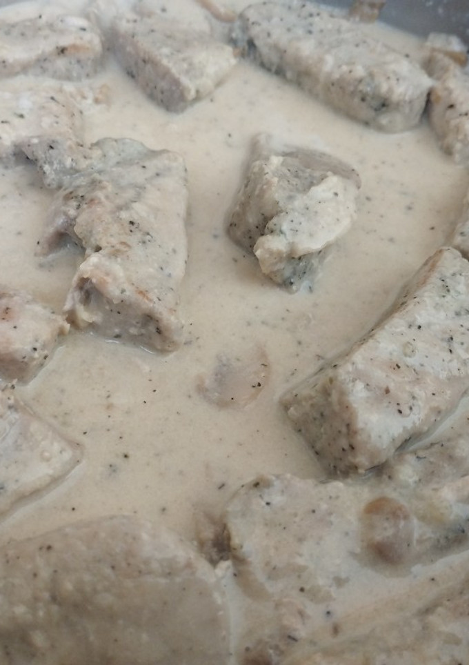 Una foto de Lomo de cerdo con champiñones a mi manera