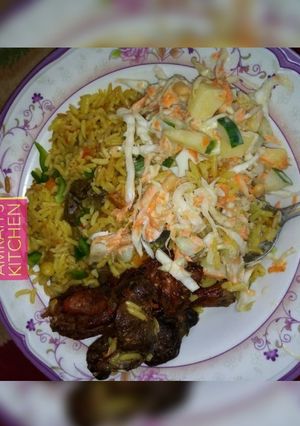 A picture of Jollof rice with coleslaw.