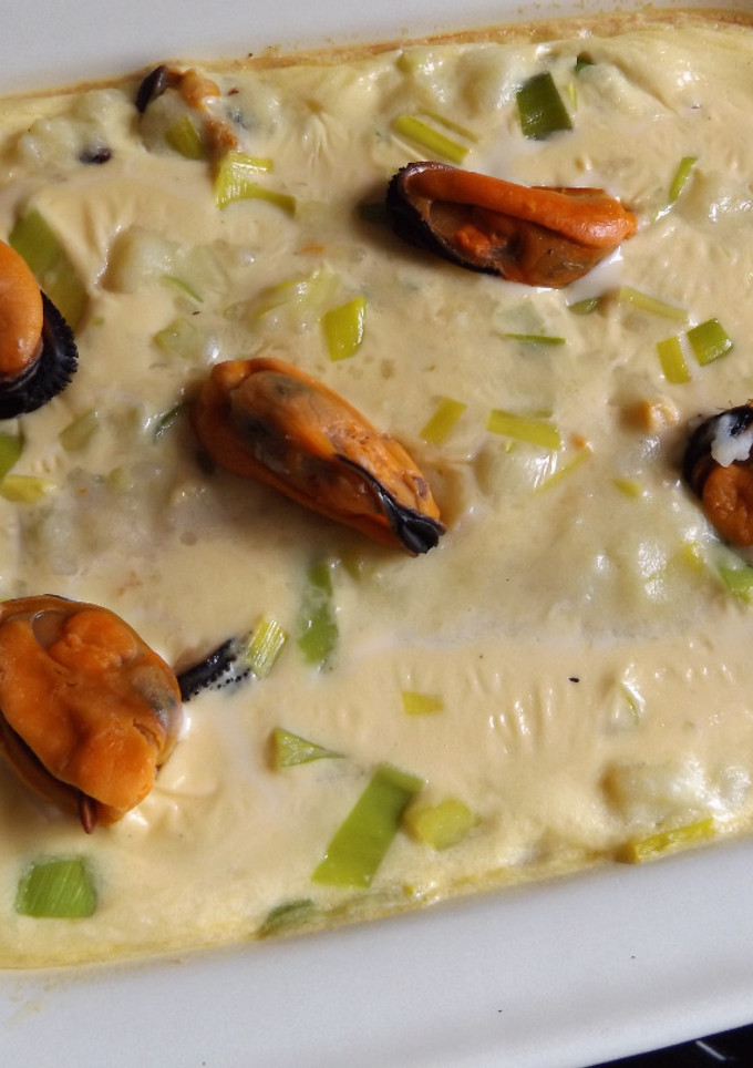 Una foto de Gratinado de mejillones con puré de patatas y puerros