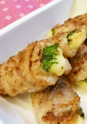 A picture of Roll and Sizzle: Cheese Wrapped in Shiso and Thinly Sliced Pork.