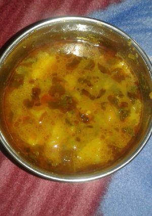 A picture of Green chole with potato.