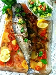 صورة لوصفة سمك بالخضار بالفرن