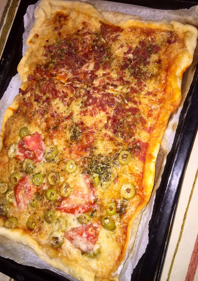 Una foto de Mitad pizza vegetariana 🧡 🧡