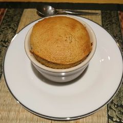 A picture of Caramel soufflé with caramel sauce.