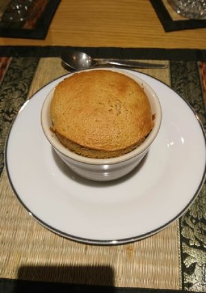 A picture of Caramel soufflé with caramel sauce.