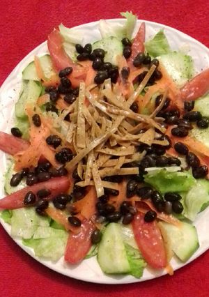 A picture of Fresh Salad with Beans and Tortilla Strips.