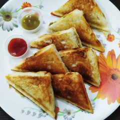 A picture of Less oil dosa potato stuffing sandwich.
