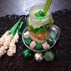 A picture of Green Custard with fruits.