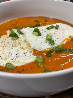A picture of Tomato Basil with Fried Eggs.