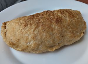 Una foto de Empanada🥟de cebolla caramelizada y carnes🥟🧅🥩