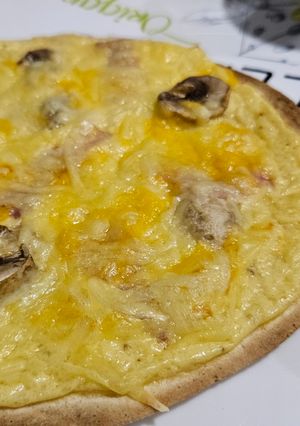 Una foto de Pizza Carbonara Exprés