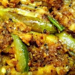 A picture of Potol narkol posto (pointed gourd in coconut poppy seed paste).