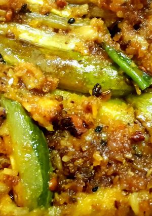 A picture of Potol narkol posto (pointed gourd in coconut poppy seed paste).