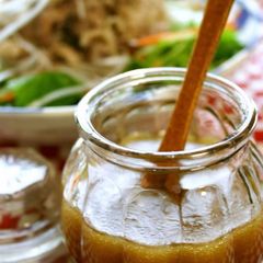 A picture of Honey Wasabi Dressing & Pork-Topped Salad.