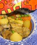 Estofado de cerdo con calabaza, patatas y guisantes